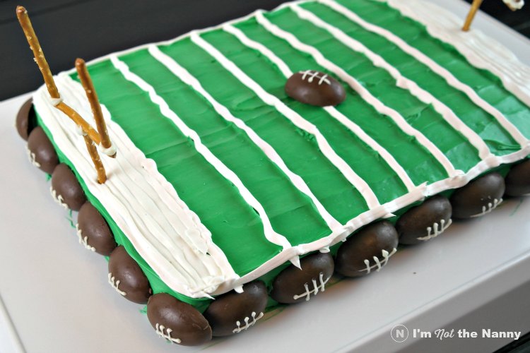 Finishing Touches on football field cake