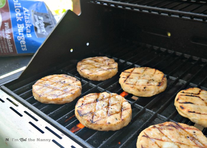 Fish burgers on grill