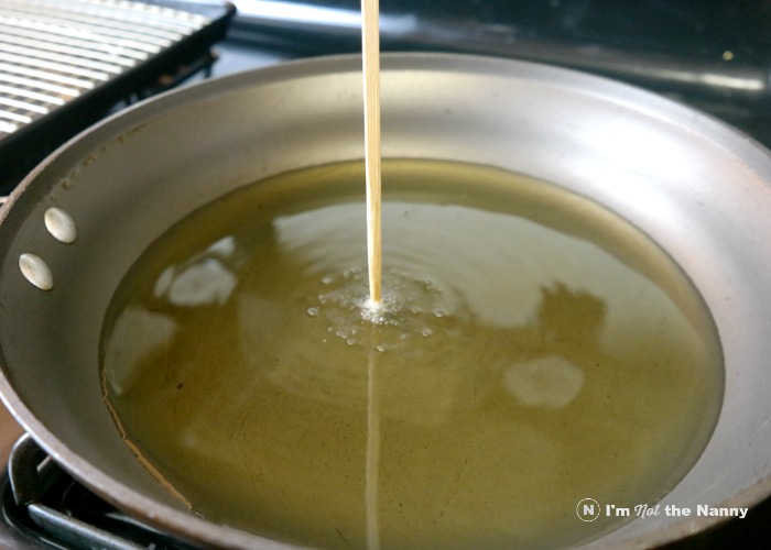 Testing temperature of oil before frying