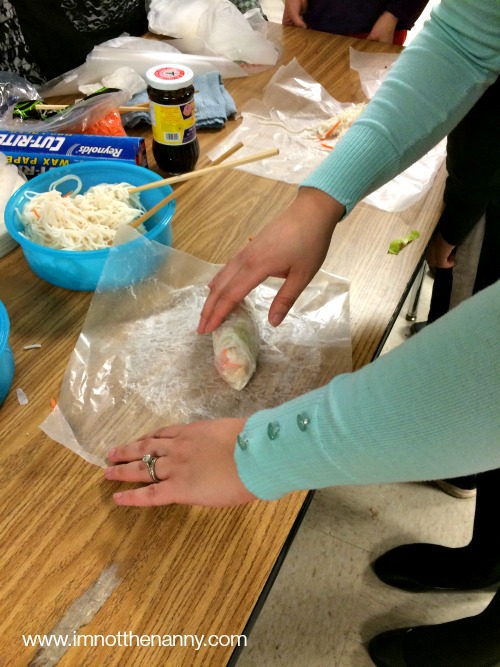 Sophia's teacher making spring roll