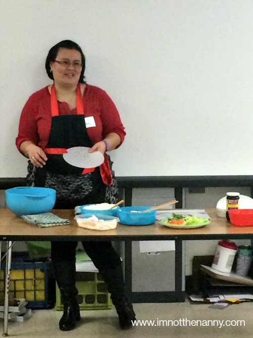 Teaching students how to make spring rolls