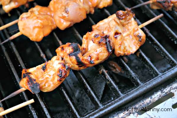 Chipotle Mango BBQ Chicken Skewers on grill via I'm Not the Nanny
