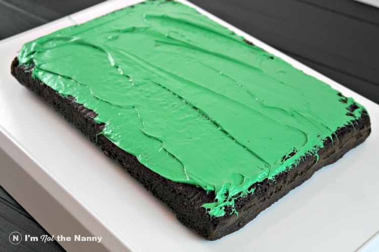 Green frosting on football field cake