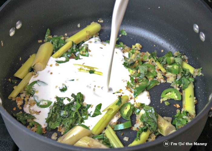 Adding coconut milk to mussels