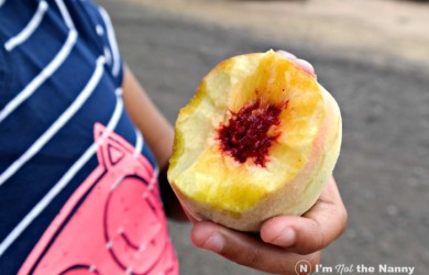 Eating a freshly picked peach